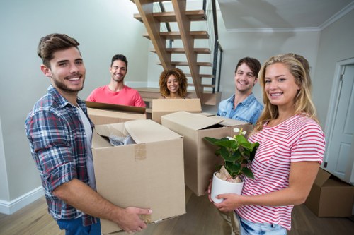 Professional team handling furniture pick-up in Nottinghill Storage.