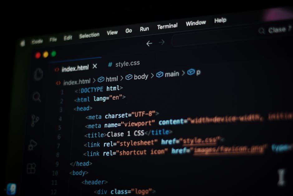 A computer screen displaying a code editor with an open HTML file named 'index.html'. The code includes elements such as the DOCTYPE declaration, html, head, and body tags, with embedded meta tags for
